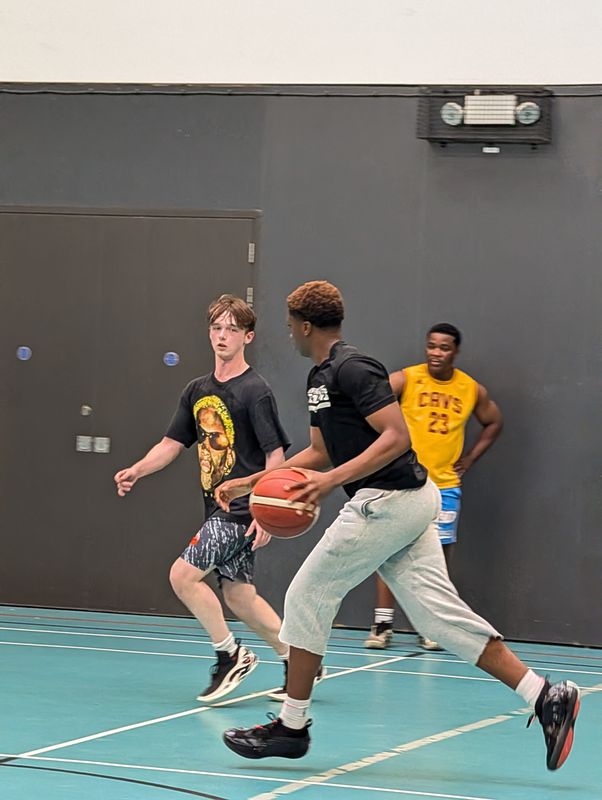 A player crossing over as a defender closes in